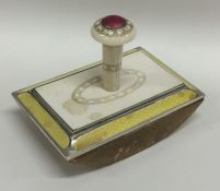 A silver and ivory mounted desk blotter with yello