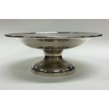 A heavy silver pedestal fruit bowl of tapering for