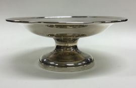 A heavy silver pedestal fruit bowl of tapering for