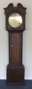 An oak cased grandfather clock with brass dial. By