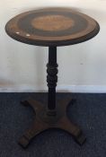 An ebony and brass mounted pedestal table. Est. £2