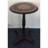 An ebony and brass mounted pedestal table. Est. £2