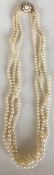 A good triple string of pearl beads with gold clas