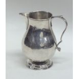 A Georgian silver sparrow beak cream jug. London 1
