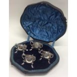 A boxed set of four silver salts with hoof decorat