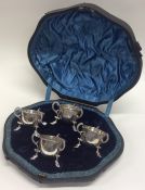 A boxed set of four silver salts with hoof decorat