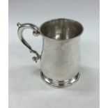 A good silver George II baluster shaped mug on ste