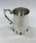 A good silver George II baluster shaped mug on ste