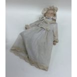 A German porcelain headed miniature doll. Est. £25