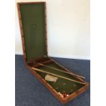 A mahogany cased ball game with fitted interior an