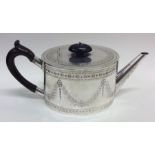 An attractive Victorian silver teapot decorated wi