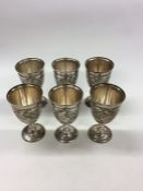 A heavy set of six Persian engraved silver goblets