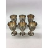 A heavy set of six Persian engraved silver goblets