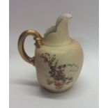 A Royal Worcester ewer decorated with flowers and