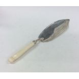 A Georgian ivory mounted silver fish slice with pi