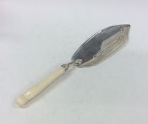 A Georgian ivory mounted silver fish slice with pi