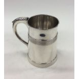 A Georgian silver tapering mug with reeded decorat