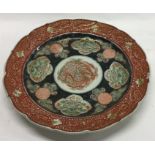 A good Imari charger with red and gilt body. Appro