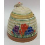 A Clarice Cliff 'Crocus' pattern honey pot decorat
