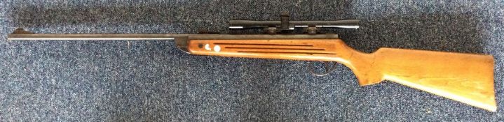 A mahogany mounted 22 air rifle. Est. £30 - £50.