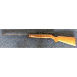 A mahogany mounted 22 air rifle. Est. £30 - £50.