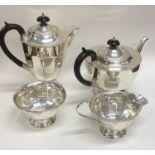 A heavy silver panelled four piece tea and coffee