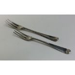 Two early Georgian silver miniature three prong fo