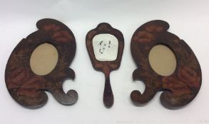 A pair of unusual painted picture frames together