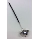 A Georgian silver toddy ladle with pouring lip and