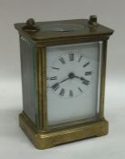 A small brass mounted carriage clock with white en