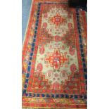 An Antique tapestry Oriental rug in bright colours