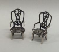 A pair of Georgian style carver silver chairs. App