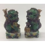A pair of decorative figures of Dogs of Foo. Est.