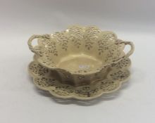 An Antique pierced creamware basket together with