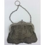 A Continental silver mesh purse on suspension chai