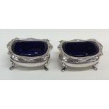 A pair of Edwardian silver salts with pierced rims