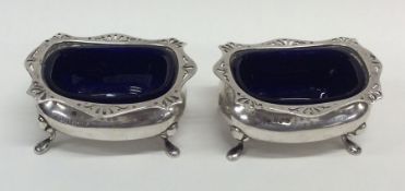 A pair of Edwardian silver salts with pierced rims