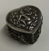 An Indian silver heart shaped bonbon dish with lif