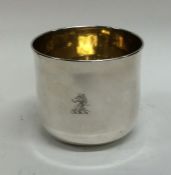 A Georgian silver tumbler cup, the side with crest