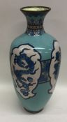 A cloisonné blue vase decorated with dragons. Appr