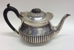 A silver half fluted teapot. Sheffield. By R&EH. A
