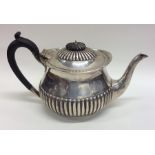 A silver half fluted teapot. Sheffield. By R&EH. A