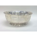 An Edwardian silver fruit bowl with wavy edge. She