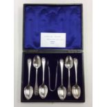 A boxed set of six Edwardian silver teaspoons deco