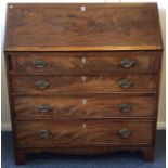 A large Georgian mahogany four drawer bureau with