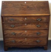 A large Georgian mahogany four drawer bureau with