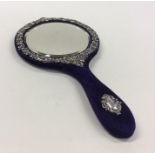 An attractive Edwardian embossed hand mirror decor