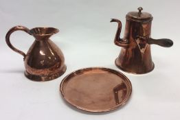 A copper side handled water jug together with a tr