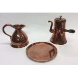 A copper side handled water jug together with a tr