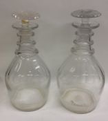 A pair of Georgian fluted decanters with tapering